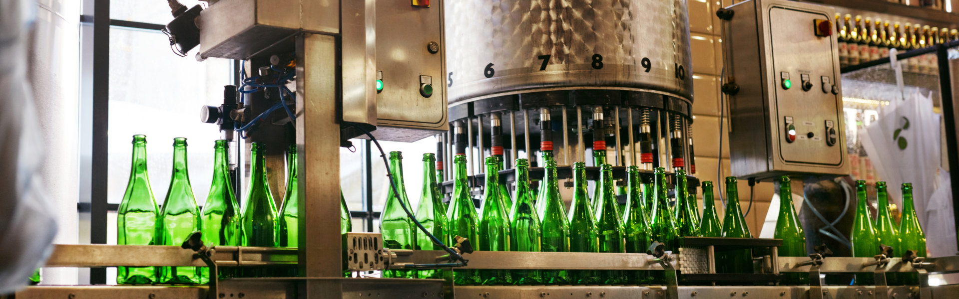 Craft Brewery Green Bottles For Alcoholic Drinks On The Assembly Line