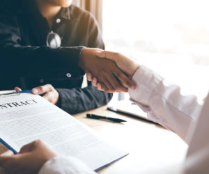 Craft Brewery People Shaking Hands After Contract Agreement